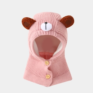Detailed view of pink knitted bear balaclava with soft lining and button closure
