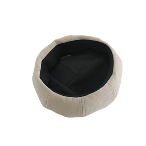 Cute beige cat ear beret for girls with warm knitted texture and soft black lining