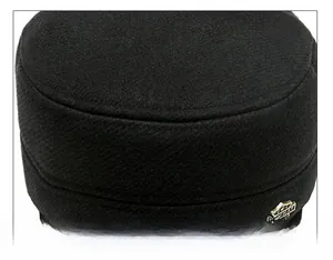 Detailed close-up of stitching quality and metal logo on men's winter wool flat cap