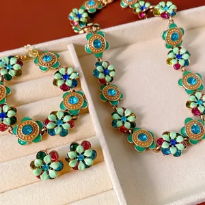 Vintage jewelry set with enamel flower necklace, bracelet and earrings in a gift box