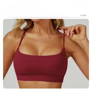 Close-up of burgundy sports bra featuring square neck design and elastic underband