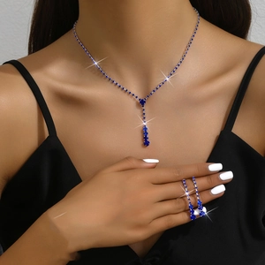 Blue crystal necklace and long earring set worn by a model for wedding occasions