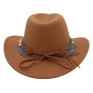 Detail of camel wool felt western hat featuring ethnic woven band and tassel charms