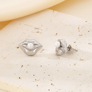 Irregular silver lip-shaped stud earrings featuring a white pearl on a stone base