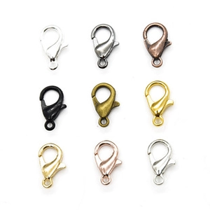 Macro view of lobster clasps in nine metallic finishes for DIY jewelry making