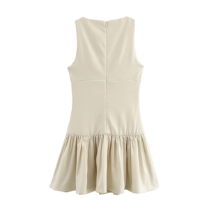 Detail of the back hidden zipper and ruffled hem on this beige sleeveless dress