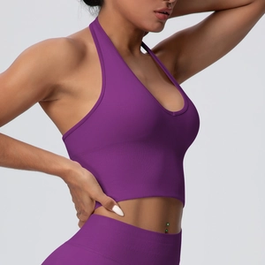 Side view of dark purple halter sports bra showing high-stretch seamless knit texture