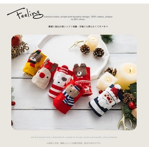 Close-up of 100% cotton Christmas socks featuring Santa, reindeer, and bear patterns