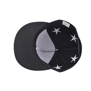 Detail view of cotton hip hop cap interior featuring star embroidery and quality labels