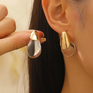 French style gold water drop earrings with transparent resin pendants on model