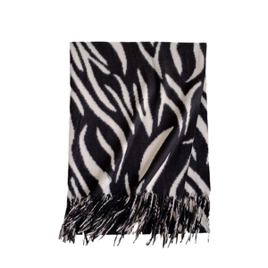 Winter striped cashmere scarf for women featuring black and white zebra pattern with tassels