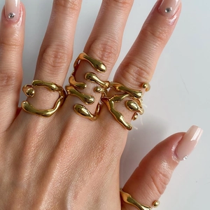 Irregular geometric lava ring in gold finish worn on hand for women and men