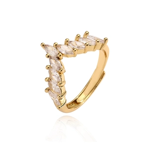 Macro shot of V-shaped gold ring featuring marquise-cut cubic zirconia and open design