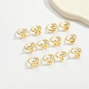 3D puffy gold alphabet rings set with minimalist adjustable opening in a matrix layout