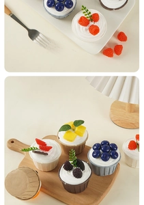 Detailed macro view of artificial cupcakes with realistic fruit toppings and cream on a plate