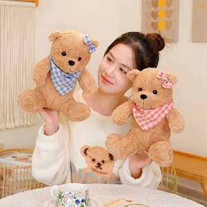 Set of two soft brown teddy bears with blue and red plaid scarves and bow ties
