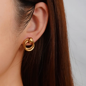 Minimalist geometric gold-plated double-circle earrings on model for modern style