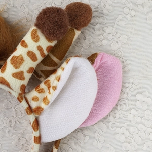 Plush giraffe headband featuring brown spots and soft ears for Halloween party costume wear