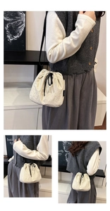 Detail shots of beige drawstring bucket bag with pleated texture and adjustable strap