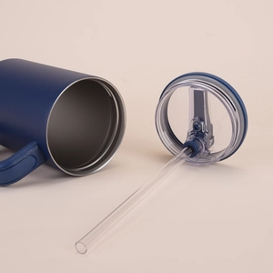 Detail of 40oz navy blue matte tumbler with leakproof lid and reusable straw