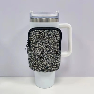 Leopard print neoprene pouch with zipper detail attached to a 40oz tumbler handle