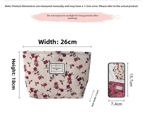 Size reference of floral corduroy toiletry bag showing 26cm width and 18cm height