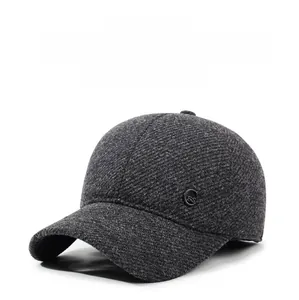 Detailed texture of thick dark grey wool blend baseball cap with metallic logo