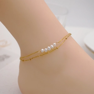 Elegant gold-plated double-layer anklet with natural pearls and round metal beads
