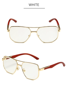 Detail of vintage square gold glasses frame with wood grain temples and double bridge