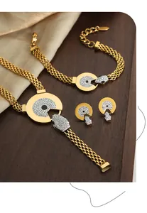 Detail shot of gold snake-head necklace and bracelet set with sparkling zircon inlays