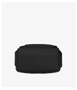 Detail of reinforced rectangular bottom base on a durable black nylon travel backpack