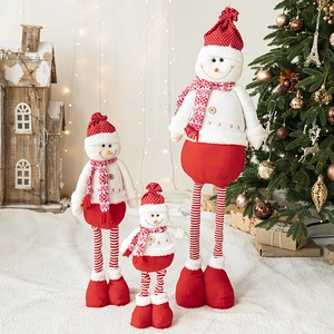 Three telescopic Christmas snowman dolls with red knit outfits for festive home decor