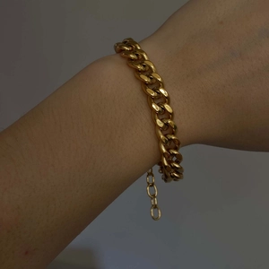 Minimalist 18k gold plated stainless steel Cuban link chain bracelet worn on wrist