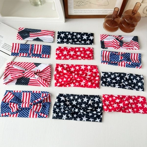 Close-up of American flag pattern hair scrunchies with stars and stripes ribbons