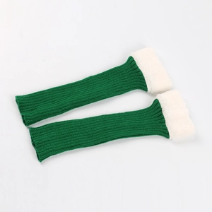 Detail of green ribbed knit leg warmers with soft white faux fur trim cuffs