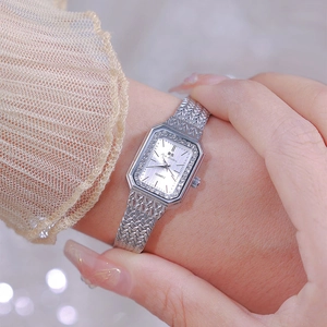 Elegant silver rectangular quartz watch with rhinestone bezel on metal mesh band