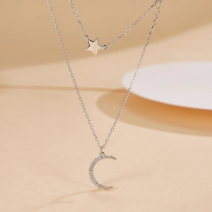 Detail of S925 silver double layer necklace with micro-pave zircon moon and star pendants