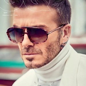 Classic aviator sunglasses with double bridge and brown amber frames on David Beckham