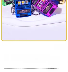 Close-up of mini slot machine keychain showing the casino fruit reels and metal lever