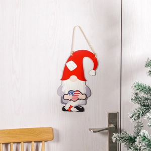 Wooden Christmas gnome door hanger with American flag heart on white background