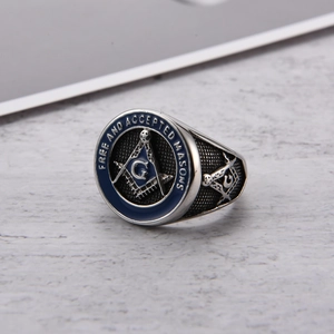 Detail of vintage Masonic ring with blue enamel and G symbol in stainless steel