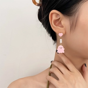 Close-up of pink ghost earring with heart stud and pearl bead on model for Halloween