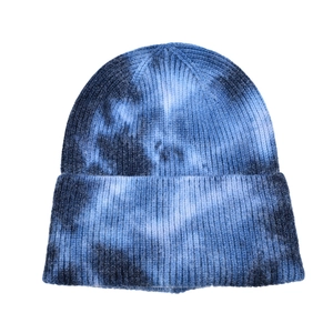 Blue and white tie-dye knit beanie with ribbed texture for winter outdoor activities