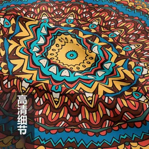 Macro close-up showing fine woven texture and bohemian mandala pattern of the tapestry