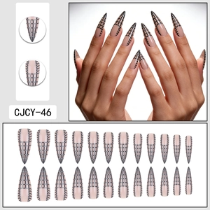 Long stiletto press-on nails with pink base, black grid patterns, and white dots 24pcs