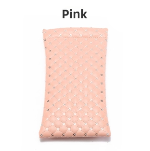 Detail of pink PU leather glasses pouch with diamond quilting and silver sequins