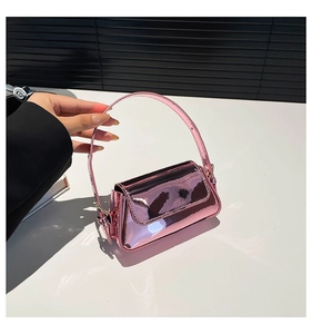 Close-up of pink metallic mirror finish shoulder bag with stylish thin handle design