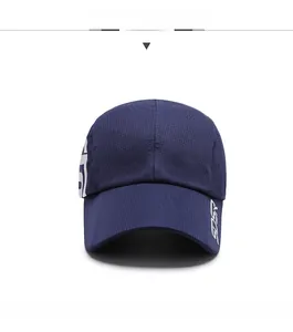 Detail of navy blue sport cap featuring breathable mesh fabric and white SPORT lettering