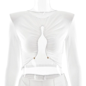 Detail of white crop top featuring keyhole cutout and decorative metal buttons