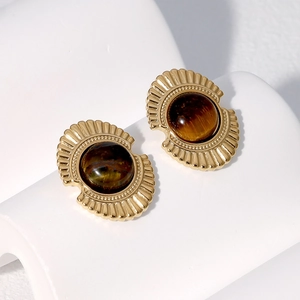 Detail view of vintage 18K gold plated fan-shaped earrings with brown tiger eye stones